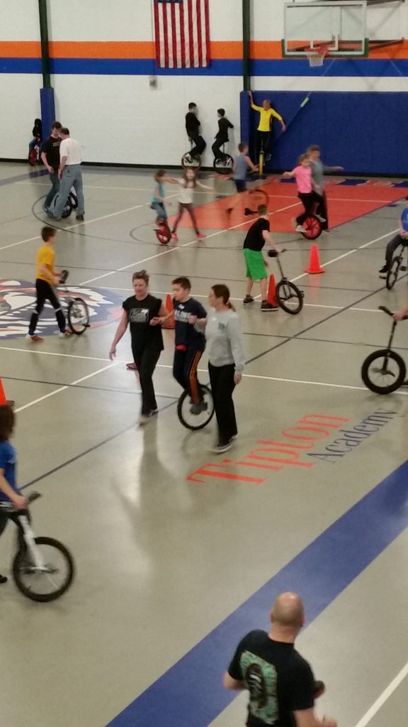 Gym full of unicyclists